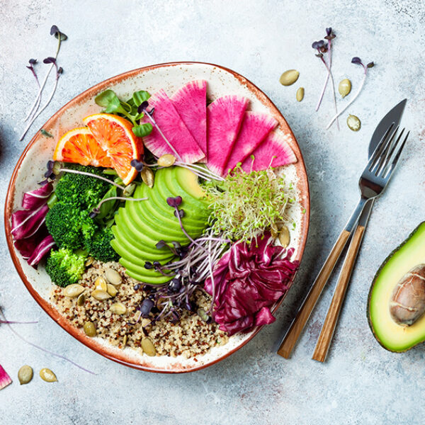 Vegan, detox Buddha bowl with quinoa, micro greens, avocado, blo
